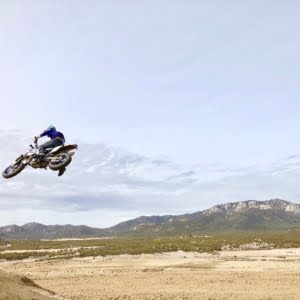 supermoto jumping the dirt